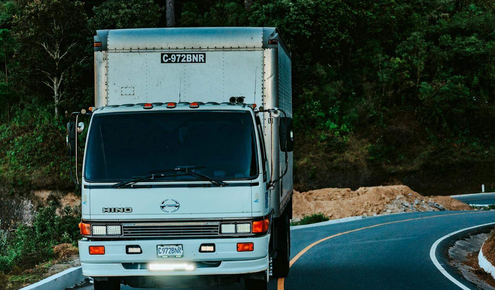 House Moving Houston box truck parked on a sunny Houston street during a summer move